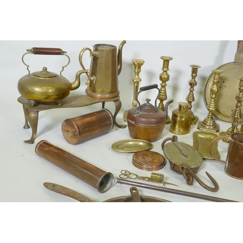 178 - A quantity of copper and brass, footman skillets, candlesticks, bed warmers, set of postage scales w... 