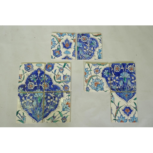 18 - Nine Iznik pottery wall tiles decorated with a foliate pattern, 20 x 23cm