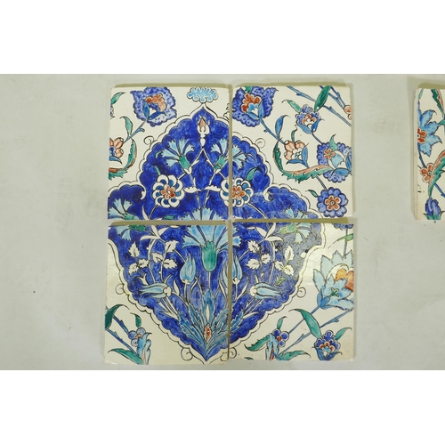 18 - Nine Iznik pottery wall tiles decorated with a foliate pattern, 20 x 23cm