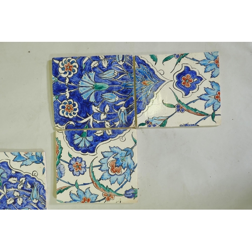 18 - Nine Iznik pottery wall tiles decorated with a foliate pattern, 20 x 23cm