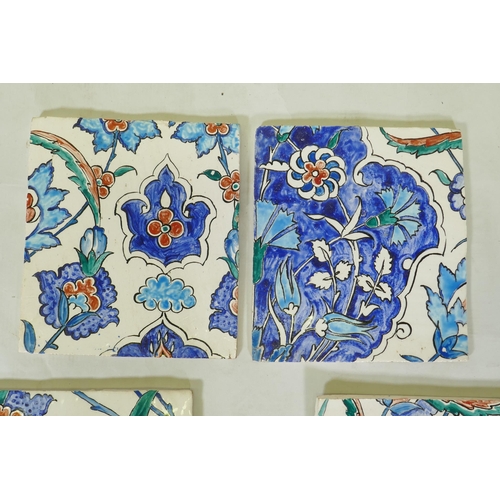 18 - Nine Iznik pottery wall tiles decorated with a foliate pattern, 20 x 23cm