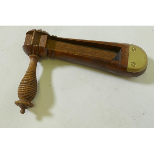 180 - A C19th wood policeman's rattle with brass mounts, 22cm long