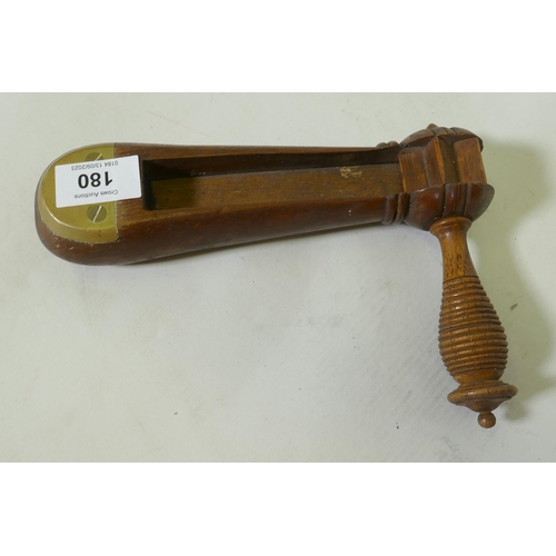 180 - A C19th wood policeman's rattle with brass mounts, 22cm long