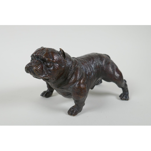 185 - A filled bronze figure of a bulldog, 19cm long