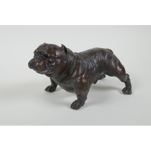 185 - A filled bronze figure of a bulldog, 19cm long