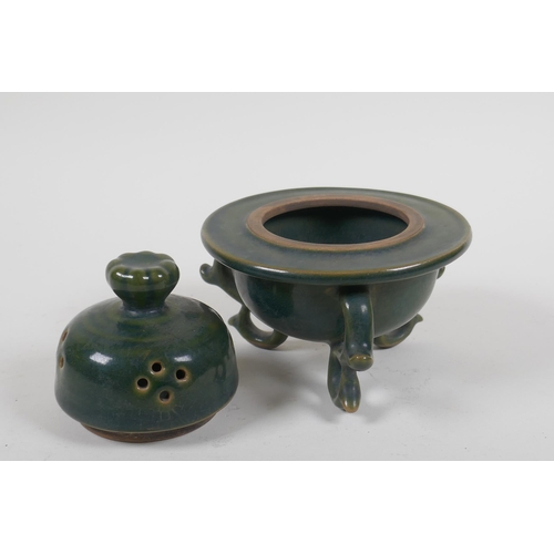 189 - A Chinese moss green glazed porcelain censer and cover, raised on tripod scrolling feet, 13cm high