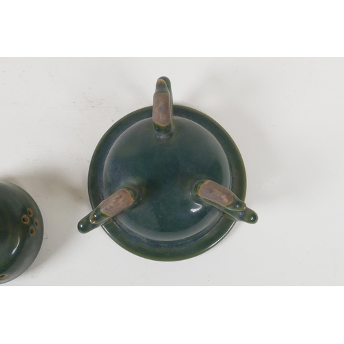 189 - A Chinese moss green glazed porcelain censer and cover, raised on tripod scrolling feet, 13cm high