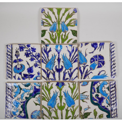 19 - Seven Iznik pottery wall tiles decorated with a foliate design, 15.5 x 15.5cm