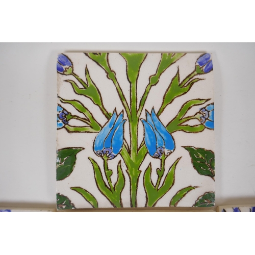 19 - Seven Iznik pottery wall tiles decorated with a foliate design, 15.5 x 15.5cm