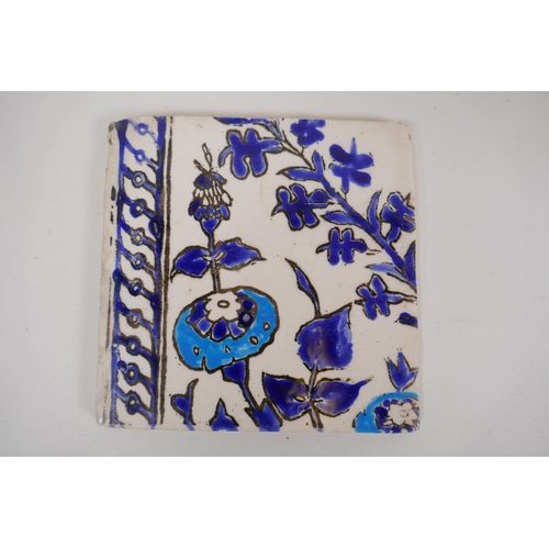 19 - Seven Iznik pottery wall tiles decorated with a foliate design, 15.5 x 15.5cm