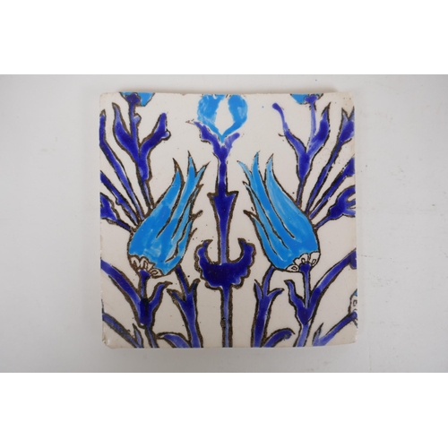 19 - Seven Iznik pottery wall tiles decorated with a foliate design, 15.5 x 15.5cm