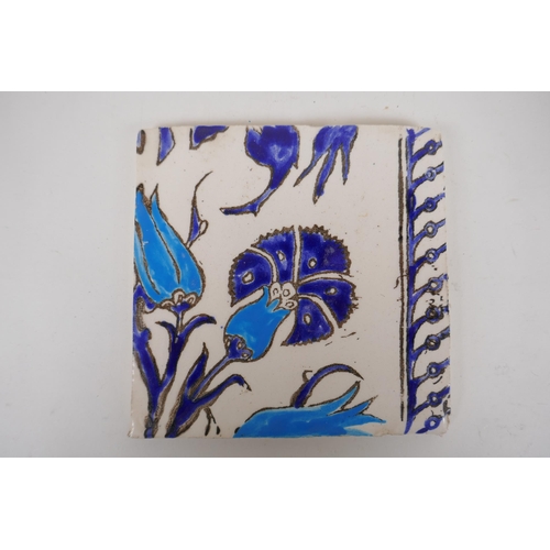 19 - Seven Iznik pottery wall tiles decorated with a foliate design, 15.5 x 15.5cm