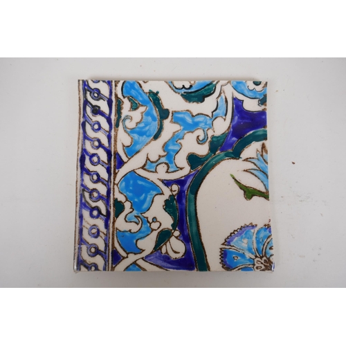 19 - Seven Iznik pottery wall tiles decorated with a foliate design, 15.5 x 15.5cm