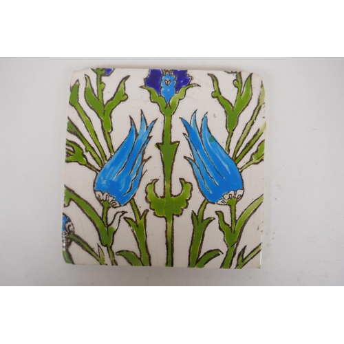 19 - Seven Iznik pottery wall tiles decorated with a foliate design, 15.5 x 15.5cm