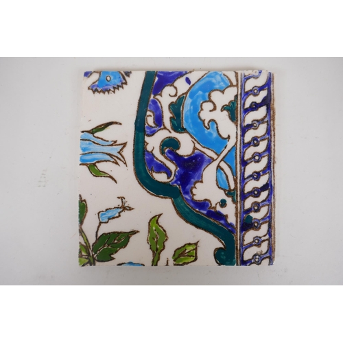 19 - Seven Iznik pottery wall tiles decorated with a foliate design, 15.5 x 15.5cm