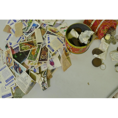 192 - A quantity of UK and world coins, costume jewellery, stamps, cigarette cards, watches, Omega stop wa... 