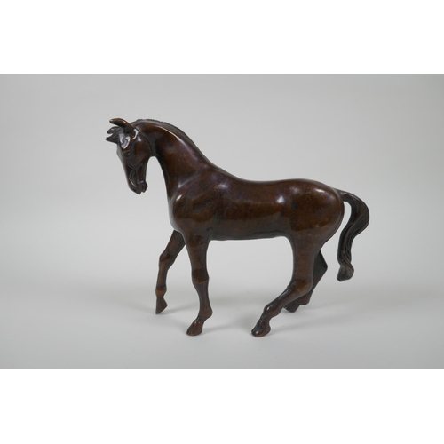 193 - A filled bronze horse, 20cm high