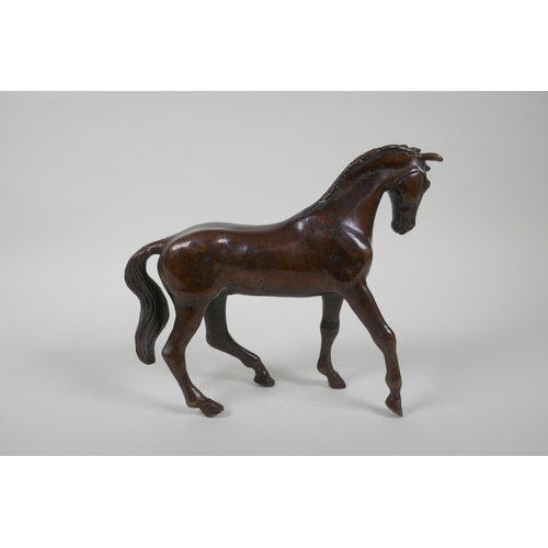 193 - A filled bronze horse, 20cm high