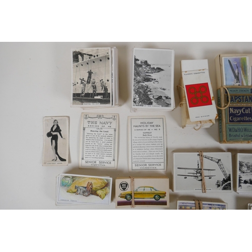 194 - A large quantity of cigarette cards from the 1920s and 30s, including some complete sets, and a comp... 