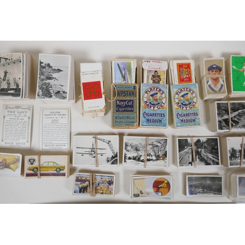 194 - A large quantity of cigarette cards from the 1920s and 30s, including some complete sets, and a comp... 