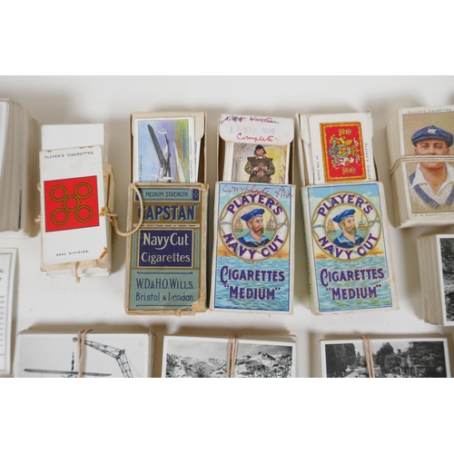 194 - A large quantity of cigarette cards from the 1920s and 30s, including some complete sets, and a comp... 