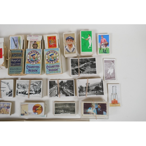 194 - A large quantity of cigarette cards from the 1920s and 30s, including some complete sets, and a comp... 