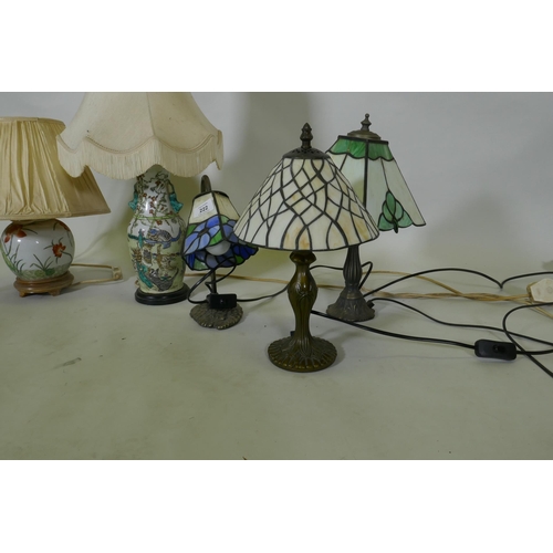 222 - Two oriental porcelain table lamps, three brass Art Nouveau style with lamps Tiffany style shades, a... 