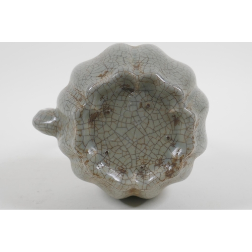 226 - A Chinese celadon crackleware teapot in the form of a gourd, 22cm high