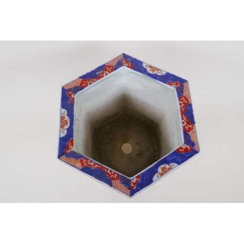 23 - A C19th Chinese Imari porcelain planter of hexagonal form, with phoenix and floral decorative panels... 