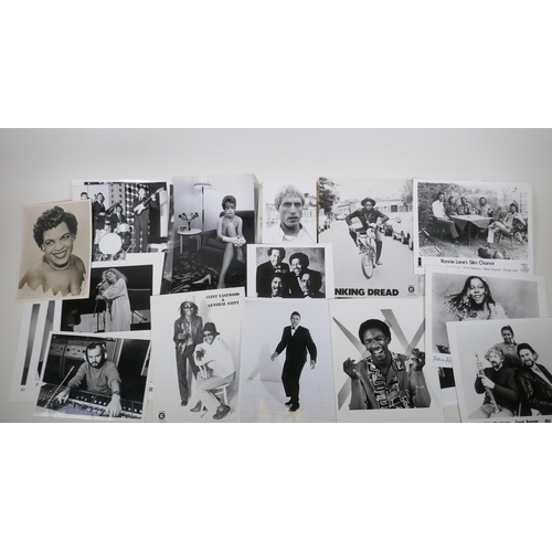 238 - A large quantity of music industry press photographs and negatives, to include Dolly Parton, Burning... 