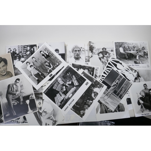 238 - A large quantity of music industry press photographs and negatives, to include Dolly Parton, Burning... 