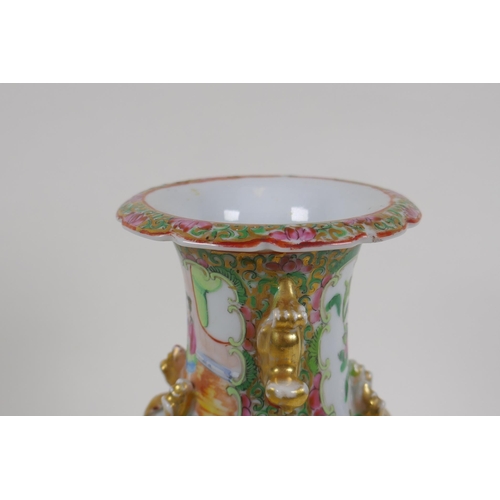 24 - A Chinese C19th Cantonese famille rose porcelain vase with gilt fo-dog handles and decorative panels... 