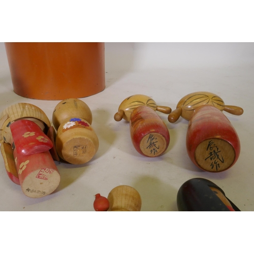 250 - Seventeen vintage Japanese Kokeshi painted wood dolls, some signed, largest 25cm high