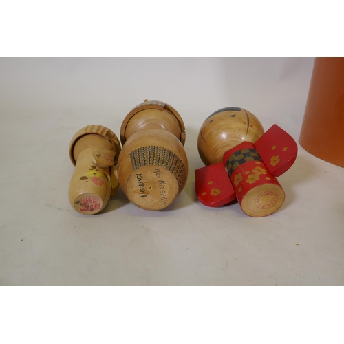 250 - Seventeen vintage Japanese Kokeshi painted wood dolls, some signed, largest 25cm high