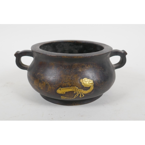 254 - A Chinese bronze two handled censer with gilt ruyi and lotus flower decoration, Xuande 6 character m... 