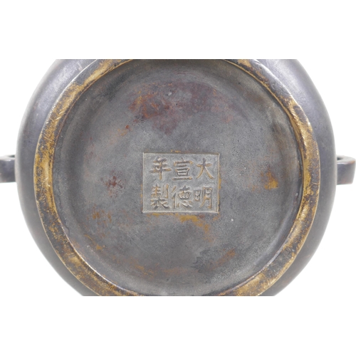 254 - A Chinese bronze two handled censer with gilt ruyi and lotus flower decoration, Xuande 6 character m... 