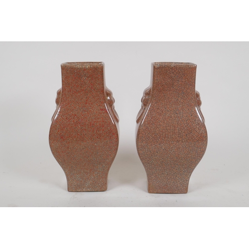 257 - A pair of Chinese crackle ware vases with kylin mask handles, seal mark to base, 22cm high