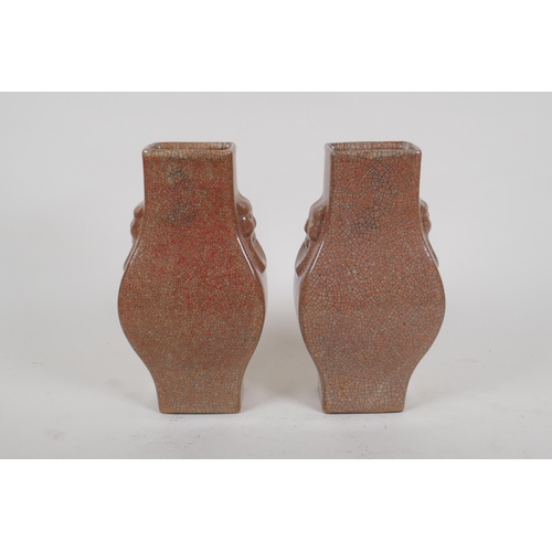 257 - A pair of Chinese crackle ware vases with kylin mask handles, seal mark to base, 22cm high