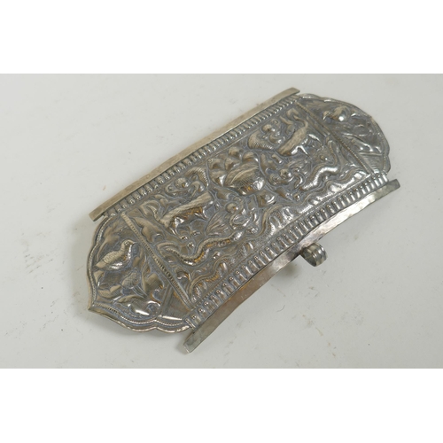 284 - A Chinese repousse white metal belt buckle decorated with mythical creatures and a goblet, 21 x 10cm