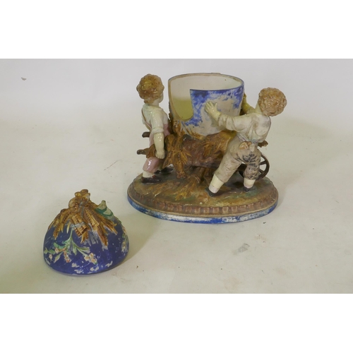 286 - C19th Majolica ceramic centrepiece in the form of three boys with a wheelbarrow, AF, 36cm high