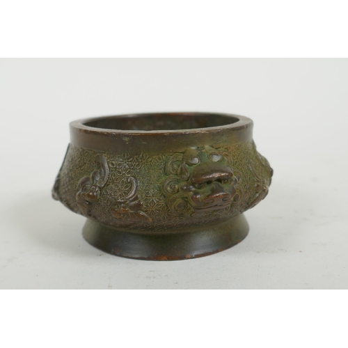 287 - A Chinese bronze censer with two lion mask handles and raised bat decoration, Qianlong 4 character m... 