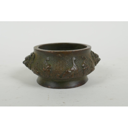 287 - A Chinese bronze censer with two lion mask handles and raised bat decoration, Qianlong 4 character m... 