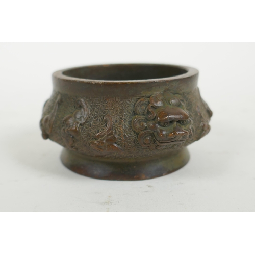 287 - A Chinese bronze censer with two lion mask handles and raised bat decoration, Qianlong 4 character m... 