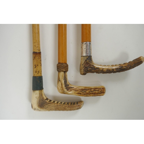 294 - Three antique antler handled riding crops including one with a hallmarked silver cuff by J. Howell a... 