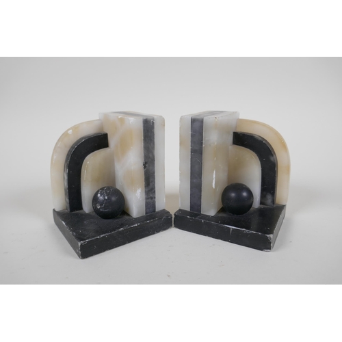 30 - A pair of 1920s Art Deco marble book ends, a pair of Art Deco style carved wood book ends, a pair of... 