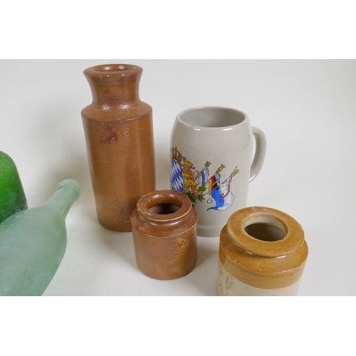 309 - A quantity of vintage glass bottles, stone ware pots and marbles, largest 23cm