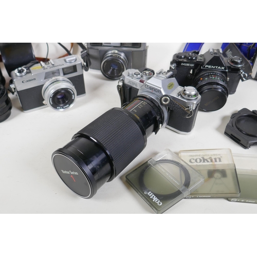 315 - A quantity of vintage cameras and equipment, including a Canon Coronet 28, a Canon AV 1, a Pentax ME... 