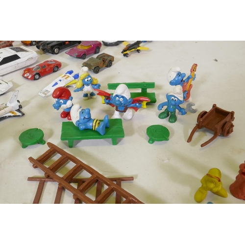 318 - A quantity of vintage children's toys to include Asterix, Snow White and the Seven Dwarfs, Smurfs, A... 