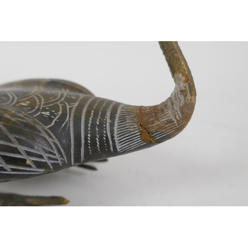 326 - An oriental carved soapstone Ibis, with metal legs, 27cm long, AF