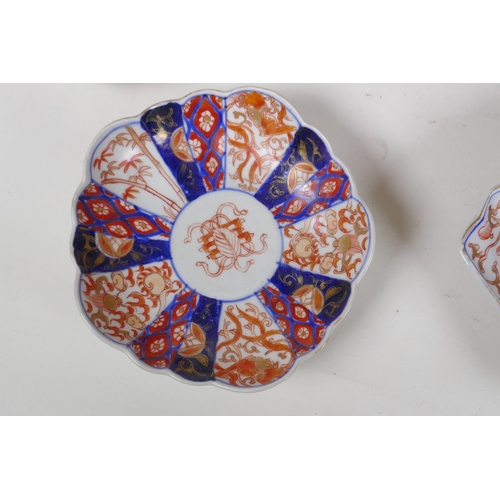 331 - A quantity of Japanese Imari porcelain, to include a cylinder vase, ribbed jar and cover, vase, fan ... 